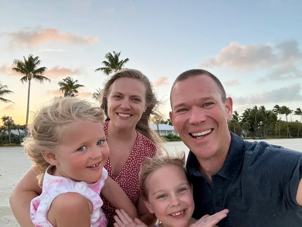 Lee with his wife and their two daughters